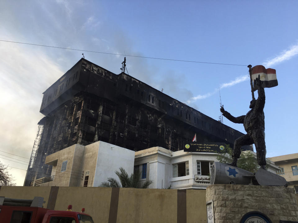 Smokes raise from the burning building of police headquarters in Ismailia, northeastern Egypt following a fire Monday, Oct. 2, 2023. A huge fire broke out early Monday in the police headquarters, injuring multiple people, the health ministry said. (AP Photo/Mohammed Awad)