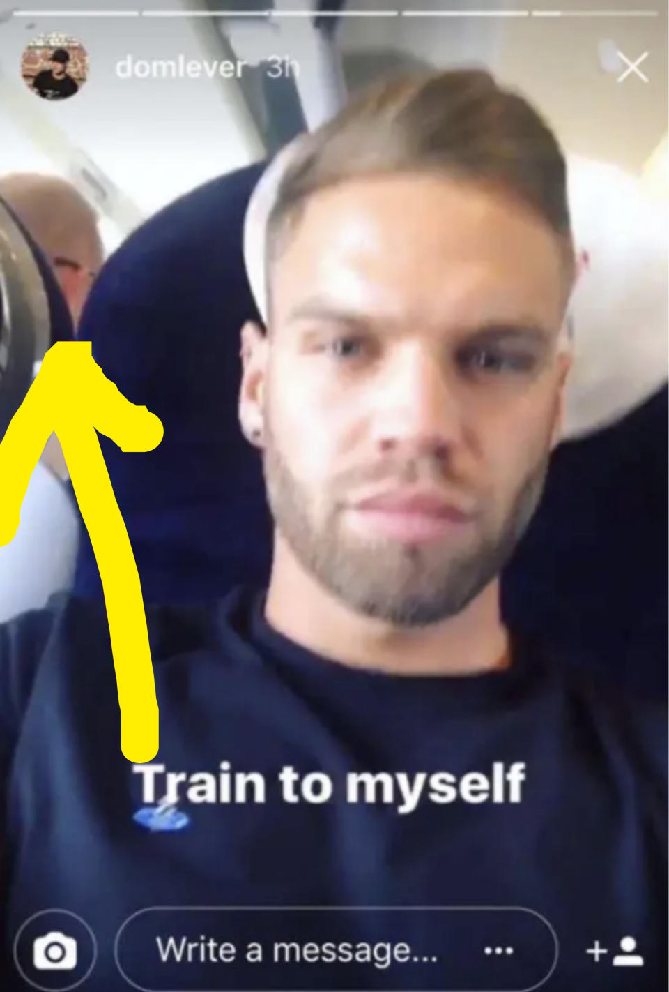 Dom taking a selfie on an empty train with text overlay "Train to myself"