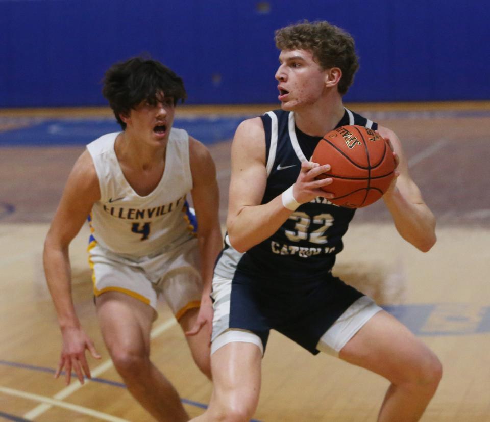 Burke Catholic's Jack O'Boyle holds off Ellenville's Alan Ibric during the Section 9 Class B championship on February 29, 2024.