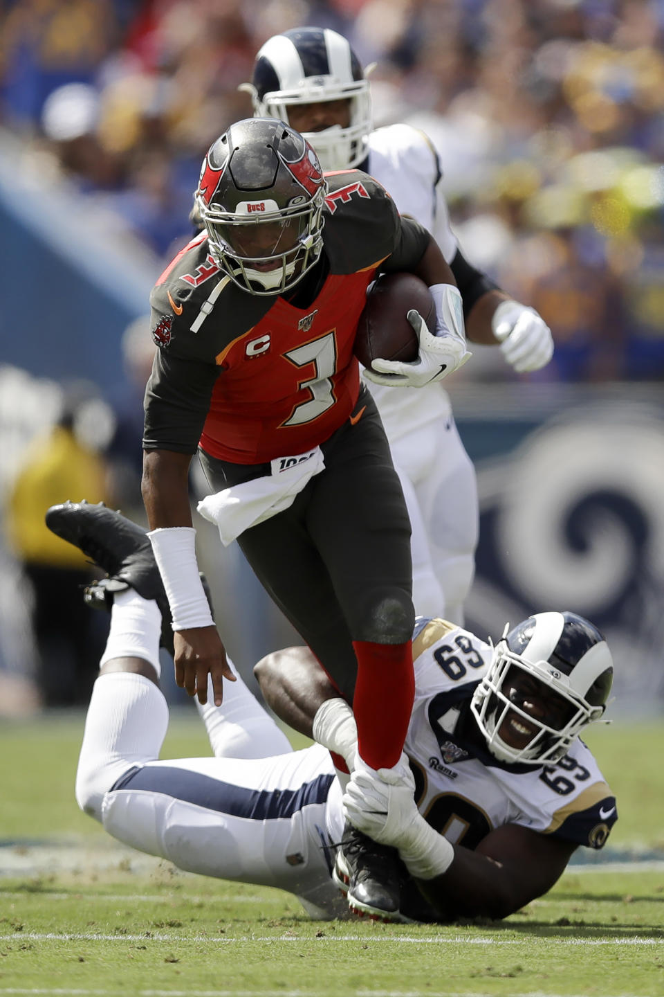 Tampa Bay Buccaneers quarterback Jameis Winston is tackled by Los Angeles Rams defensive tackle Sebastian Joseph-Day during the first of an NFL football game Sunday, Sept. 29, 2019, in Los Angeles. (AP Photo/Marcio Jose Sanchez)