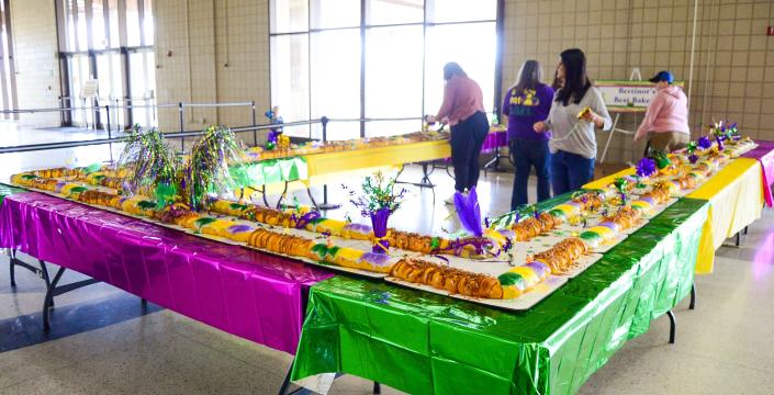 Staff members and owners of Bertinot&#39;s Best Bakery assemble and decorate a King Cake on Saturday, Jan. 8, 2022, for the Twelfth Night with a Twist event at Houma-Terrebonne Civic Center that took place later that evening.