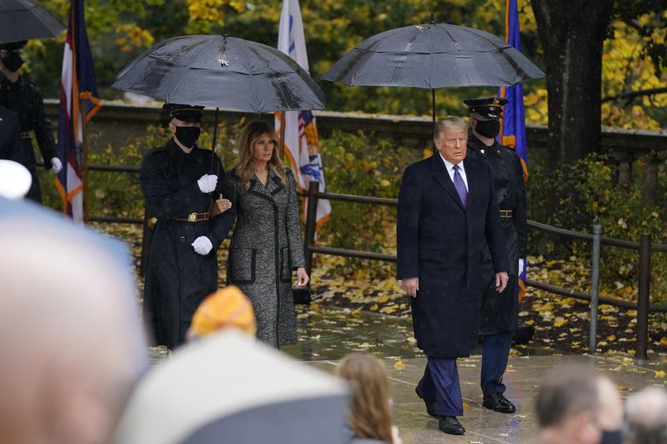 President Donald Trump and first lady Melania Trump arrive to participate in a Veterans Day wreath laying ceremony at the Tomb of the Unknown Soldier at Arlington National Cemetery in Arlington, Va., Wednesday, Nov. 11, 2020. (AP Photo/Patrick Semansky)