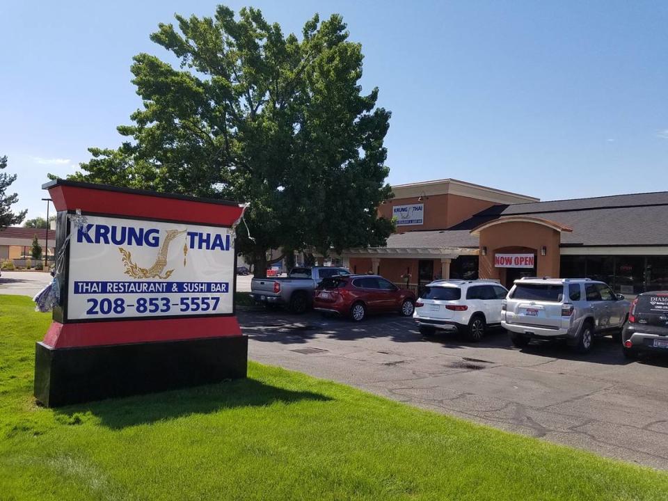 Cars fill parking spaces on Friday in front of the new Krung Thai.