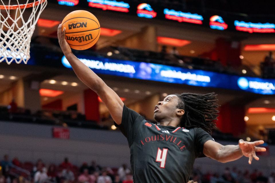 Louisville Cardinals guard Ty-Laur Johnson (4) goes for a layup during their game against the Florida State Seminoles on Saturday, Feb. 3, 2024 at KFC YUM Center.