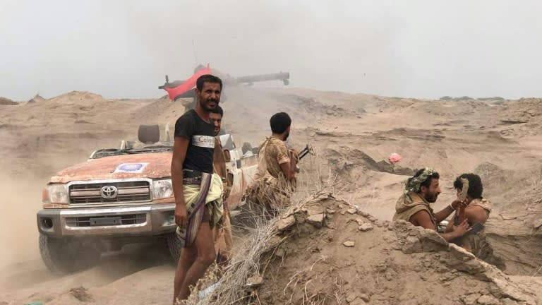 Yemeni pro-government forces man a barricade in Al-Fazah district of Yemen's Hodeida province on June 16, 2018