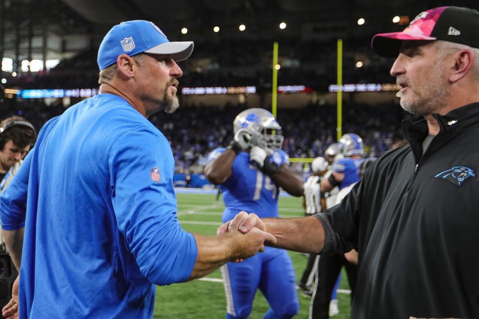 Lions coach Dan Campbell shakes hands with Panthers coach Frank Reich after the Lions' 42-24 win on Sunday, Oct. 8, 2023, at Ford Field.