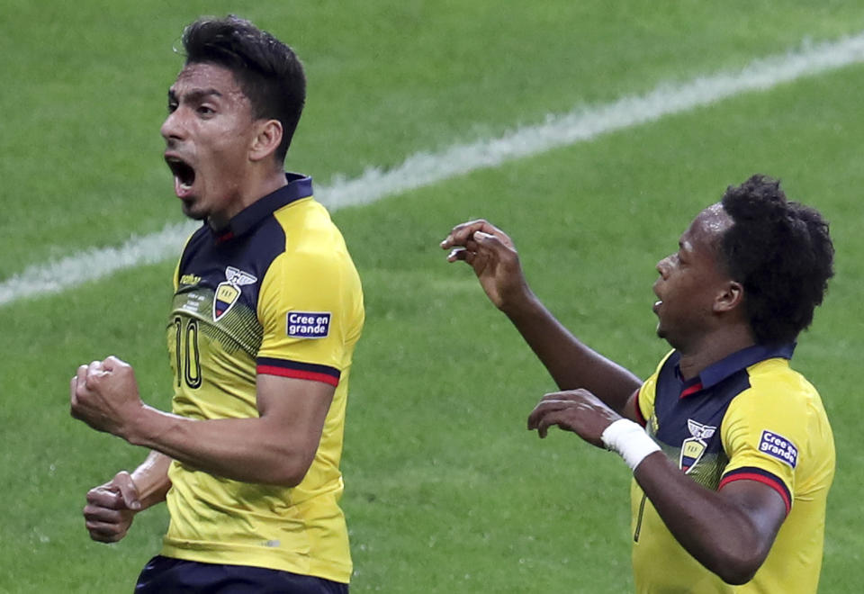 Ecuador's Angel Mena, left, celebrates scoring his team's equalizer against Japan, as teammate Romario Ibarra runs next to him during a Copa America Group C soccer match at the Mineirao stadium in Belo Horizonte, Brazil, Monday, June 24, 2019. (AP Photo/Natacha Pisarenko)