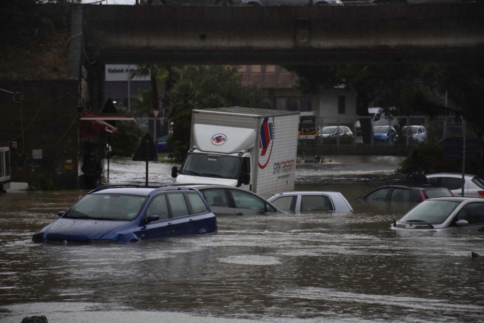 Cars submerged in Catania, Sicily, after heavy rain hit the city (ANSA/AFP via Getty Images)