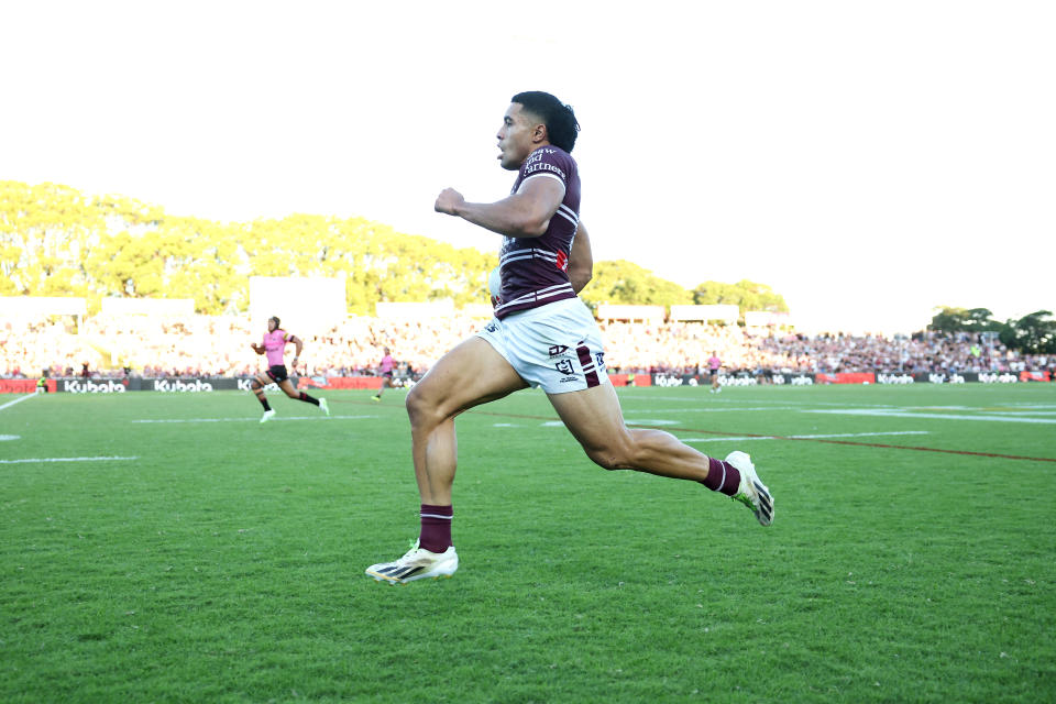 Tolutau Koula scores.