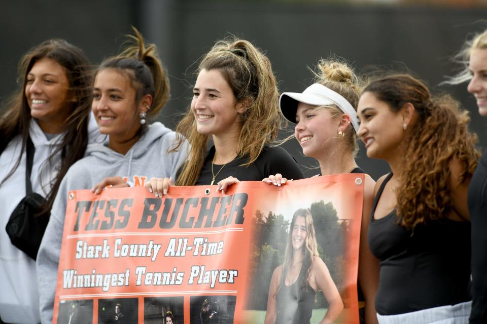 Hoover senior Tess Bucher is honored by her team after winning the Division I sectional final and becoming Stark County's all-time winningest player earlier this month.