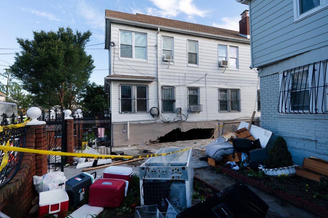 Damage to the side of a building from the remnants of Hurricane Ida is shown on Thursday, Sept. 2, 2021 in the Queens borough of New York.  Some of the occupants were killed when several feet of water collapsed the wall to their basement apartment and flooded the apartment.