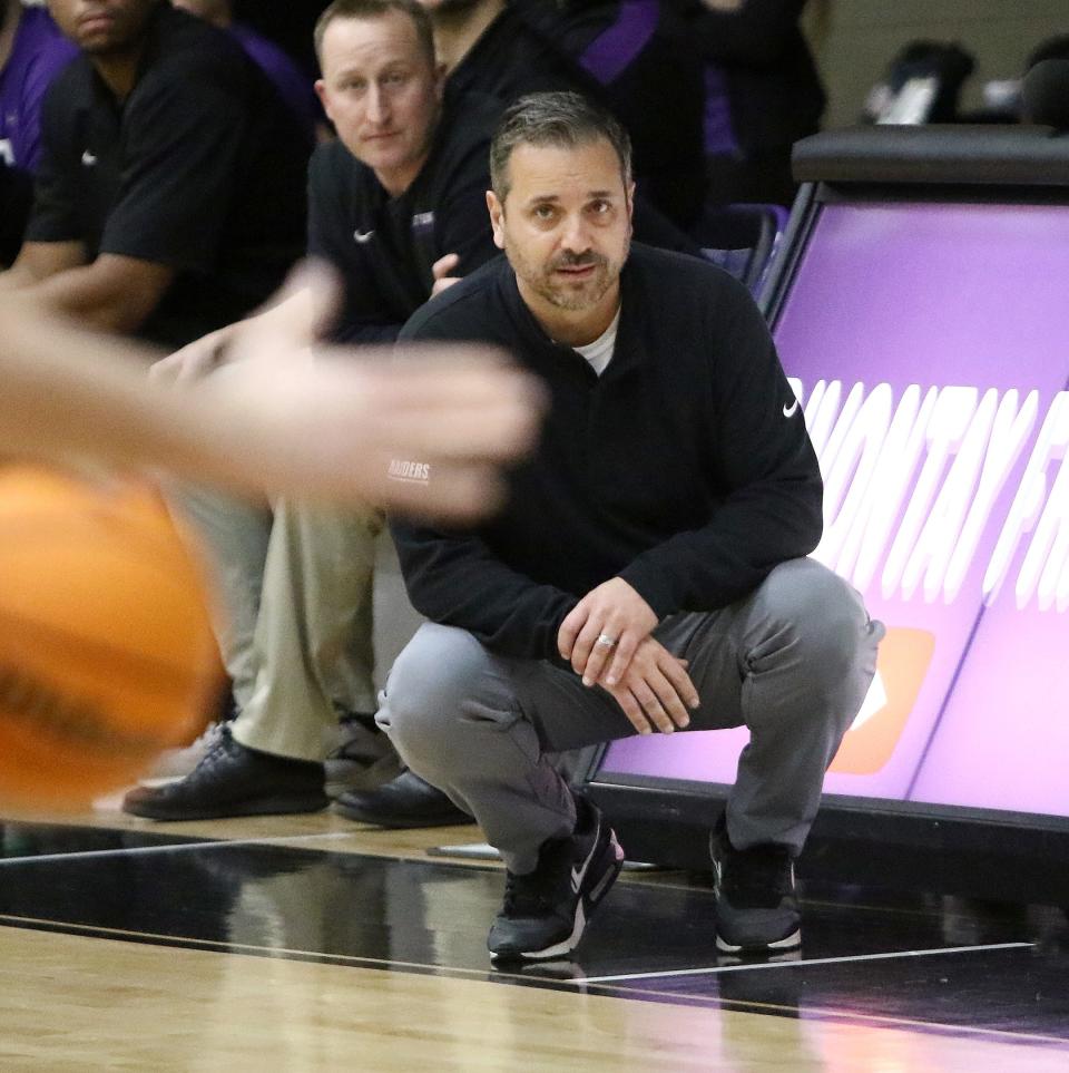 Mount Union head coach Mike Fuline in front of the bench, Wednesday, Feb. 15, 2023.