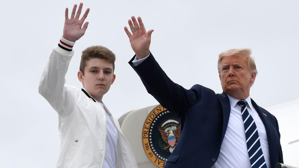 Mandatory Credit: Photo by Susan Walsh/AP/Shutterstock (10954813a)President Donald Trump, right, and his son Barron Trump wave from the top of the steps to Air Force One at Morristown Municipal Airport in Morristown, N.