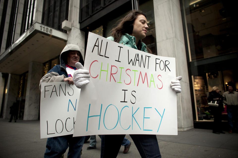 NEW YORK, NY - DECEMBER 1:  Hockey fans protest the National Hockey League (NHL) lockout outside the NHL offices in midtown Manhattan December 1, 2012 in New York City.  The NHL and the NHL Players&#39; Association have been at a stalemate in brokering a new collective bargaining agreement leaving teams locked out for over 75 days.  (Photo by Allison Joyce/Getty Images)