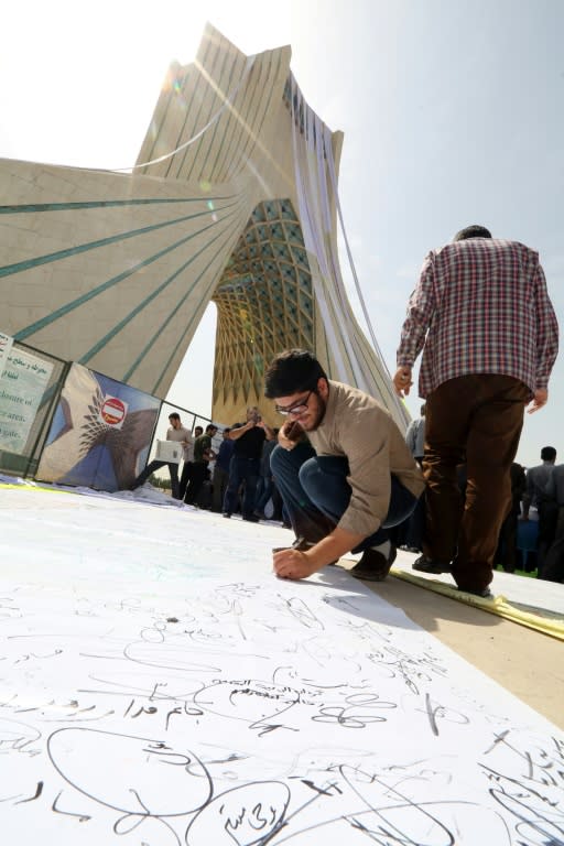 A man signs a petition at Tehran's Azadi (Freedom) Square on June 30, 2015, calling for a "good" nuclear deal