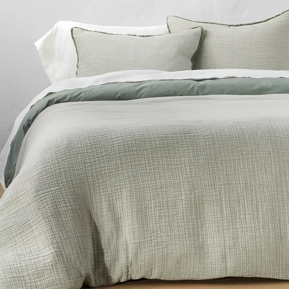 Textured bedding set with pillows and duvet on a bed, for a bedroom decor article