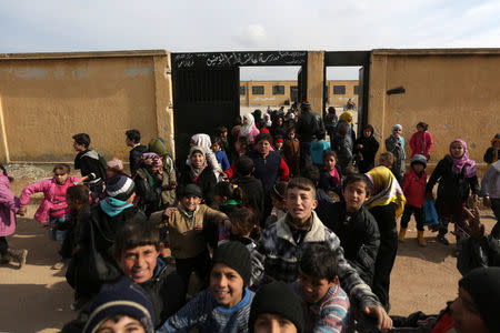 Students are seen leaving, after class, the 'Aisha Mother of the BelieversÕ school which was recently reopened after rebels took control of al-Rai town from Islamic State militants, Syria January 16, 2017. Picture taken January 16, 2017. REUTERS/Khalil Ashawi