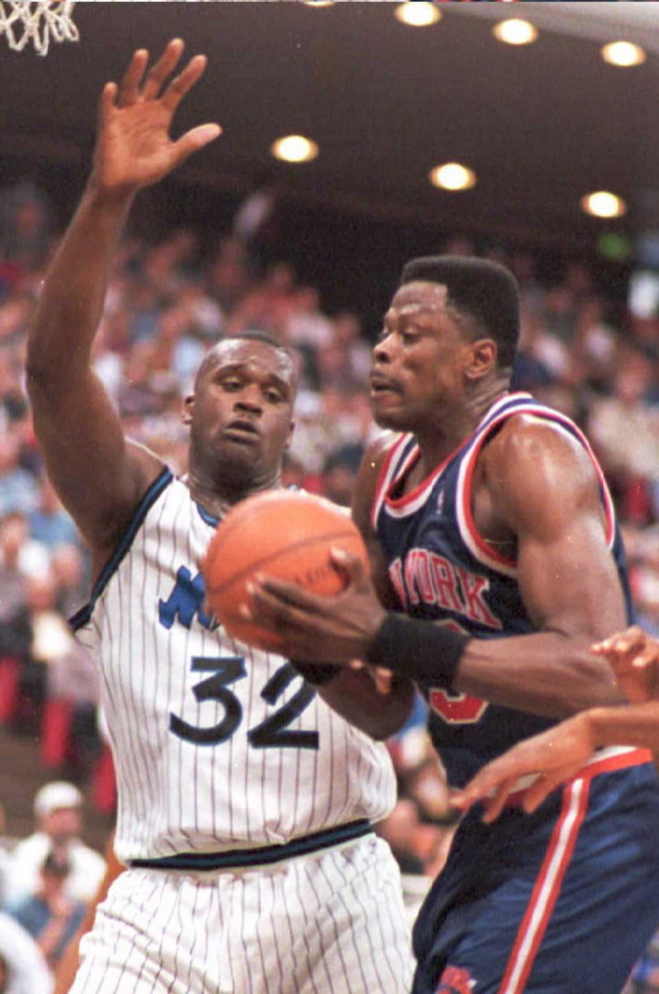 New York Knicks center Patrick Ewing takes control of a Knicks rebound from Shaquille O'Neal during the first period of the game at the Arena 5 February in Orlando, Fl. (TONY RANZE/AFP/Getty Images)