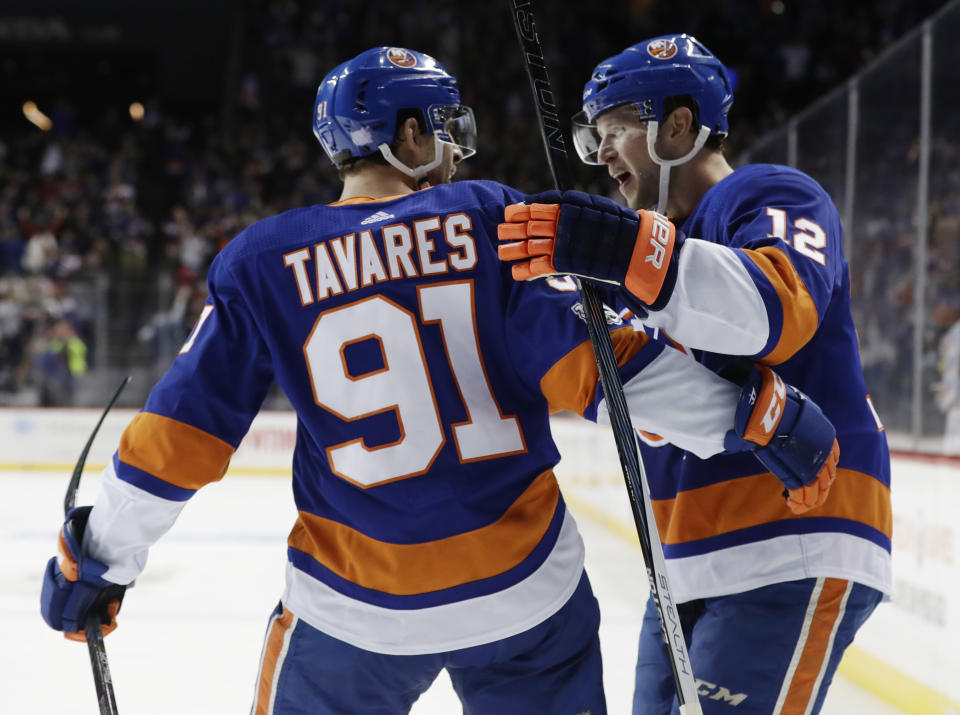 New York Islanders right wing Josh Bailey (12) celebrates with teammate John Tavares (91) after scoring the game winning goal Wednesday. (AP Photo/Frank Franklin II)