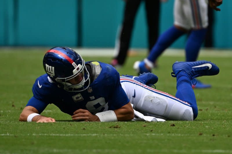 New York Giants quarterback Daniel Jones hits the ground while playing against the Miami Dolphins on Sunday at Hard Rock Stadium in Miami Gardens, Fla. Photo by Larry Marano/UPI