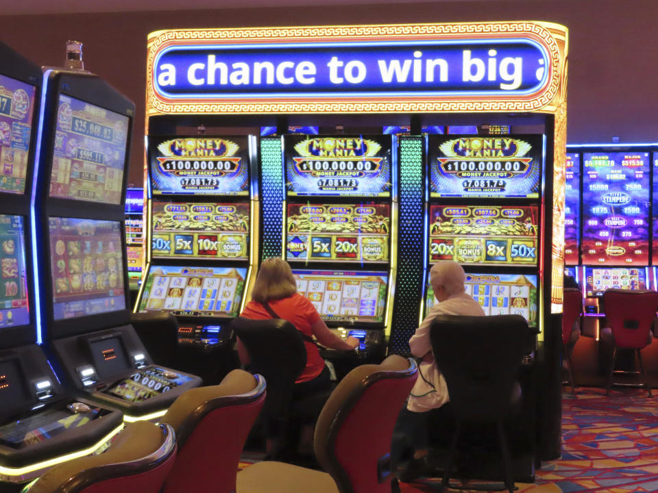 Gamblers play slot machines at the Hard Rock casino in Atlantic City, N.J., on May 17, 2023. All nine Atlantic City casinos turned a profit in the second quarter of this year, although that collective profit was down more than 20% from a year ago. Figures released Tuesday, Aug. 22, by the New Jersey Division of Gaming Enforcement show the casinos posted a gross operating profit of nearly $146 million in the second quarter of this year. (AP Photo/Wayne Parry)