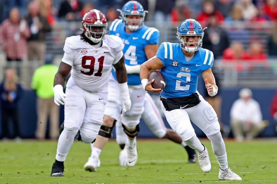 OXFORD, MISSISSIPPI - NOVEMBER 12: Jaxson Dart #2 of the Mississippi Rebels carries the ball during the first half against the Alabama Crimson Tide at Vaught-Hemingway Stadium on November 12, 2022 in Oxford, Mississippi. (Photo by Justin Ford/Getty Images)