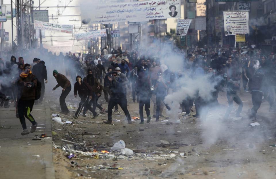 Supporters and opponents of ousted President Mursi clash at Nasr City district in Cairo