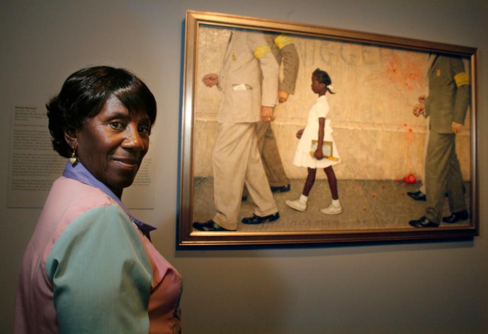 Lucille Bridges, mother of Ruby Bridges, with the Norman Rockwell painting depicting her daughter’s courageous attendance of a newly desegregated high school in Louisiana in 1960 (AP)