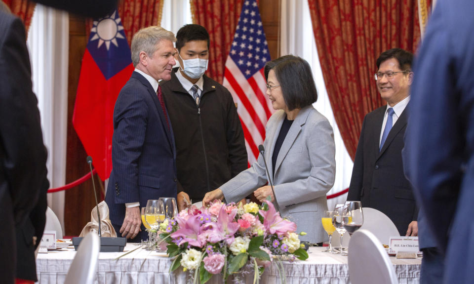 In this photo released by the Taiwan Presidential Office, House Foreign Affairs Committee Chairman Michael McCaul, R-Texas, left, and Taiwan's President Tsai Ing-wen, speak at a luncheon during a visit by a Congressional delegation to Taiwan in Taipei, Taiwan, Saturday, April 8, 2023. China sent warships and dozens of fighter jets toward Taiwan on Saturday, the Taiwanese government said, in retaliation for a meeting between the U.S. House of Representatives speaker and the president of the self-ruled island democracy claimed by Beijing as part of its territory. (Taiwan Presidential Office via AP)