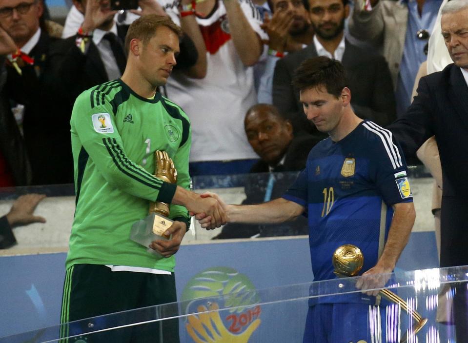 Golden Glove winner Germany's Neuer congratulates Golden Ball winner Argentina's Messi after their 2014 World Cup final in Rio de Janeiro