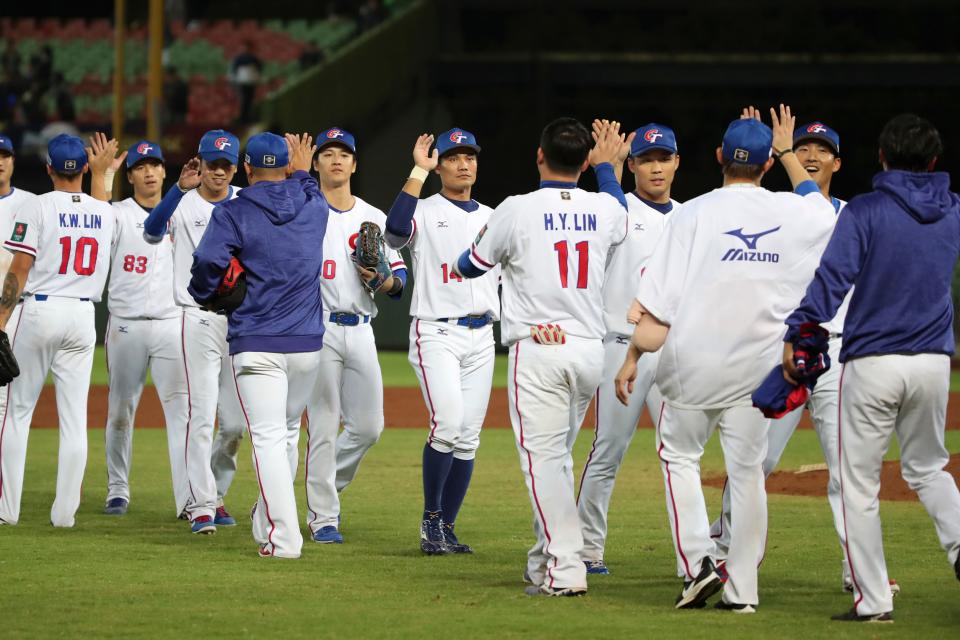 Taiwan's players celebrate their 6-1 win against Puerto Rico during the premier 12 group B of the WBSC in Taichung on November 5, 2019. (Photo by Alex Lee / AFP) (Photo by ALEX LEE/AFP via Getty Images)