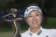Jin Young Ko, of South Korea, poses for a photo with the trophy after winning the LPGA Cognizant Founders Cup golf tournament in a playoff, Sunday, May 14, 2023, in Clifton, N.J. (AP Photo/Seth Wenig)