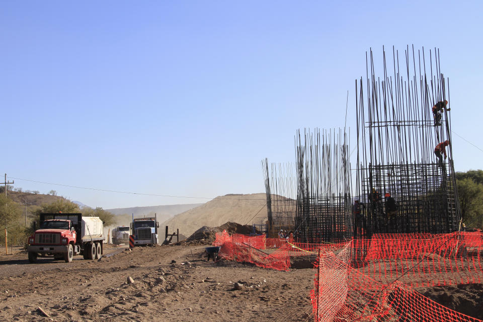 Construction continues for a new train line in northern Mexico, in San Lorenzo, Sonora state, Mexico, Monday, Nov. 13, 2023. Residents in the northern state of Sonora are battling the new train line which they say threatens to displace their homes and cut up the local ecosystem. (AP Photo/Luis Castillo)