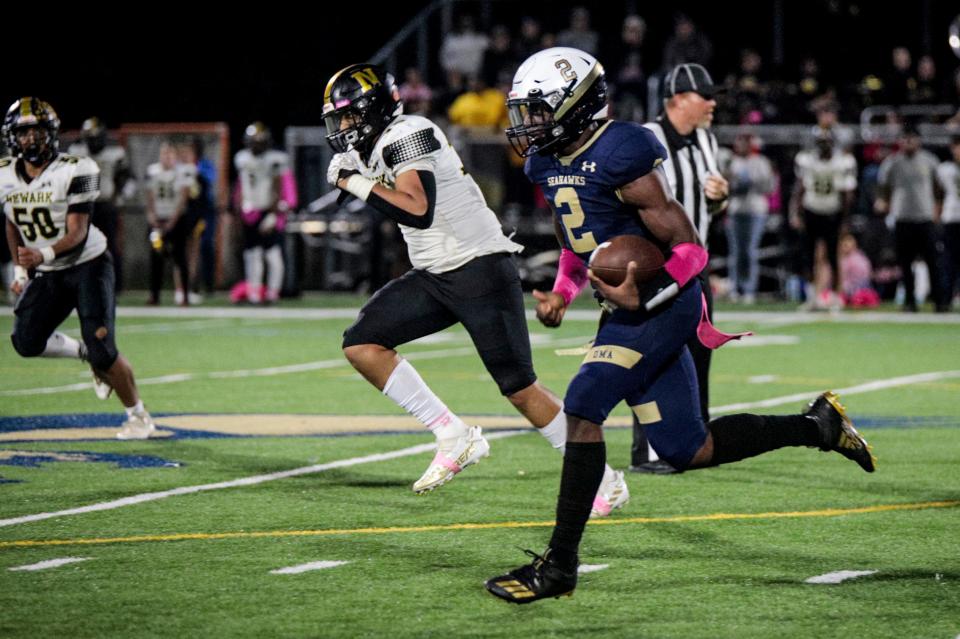 DMA's Odell Teel breaks off a big run in Delaware Military Academy's 28-14 victory over Newark, Friday, October 27 at Fusco Field in Wilmington.