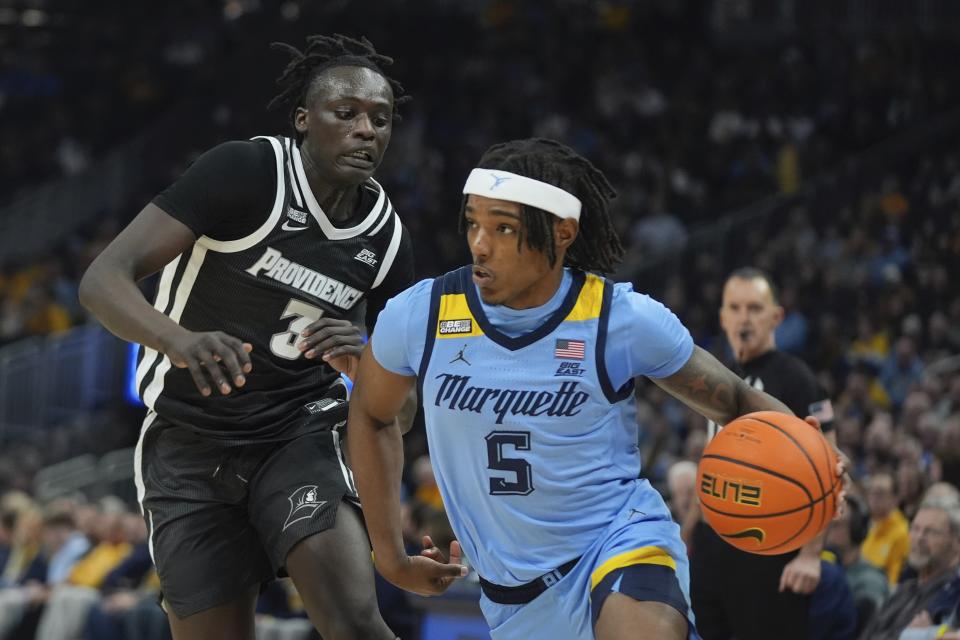 Marquette's Tre Norman gets past Providence's Garwey Dual during the first half of an NCAA college basketball game Wednesday, Feb. 28, 2024, in Milwaukee. (AP Photo/Morry Gash)