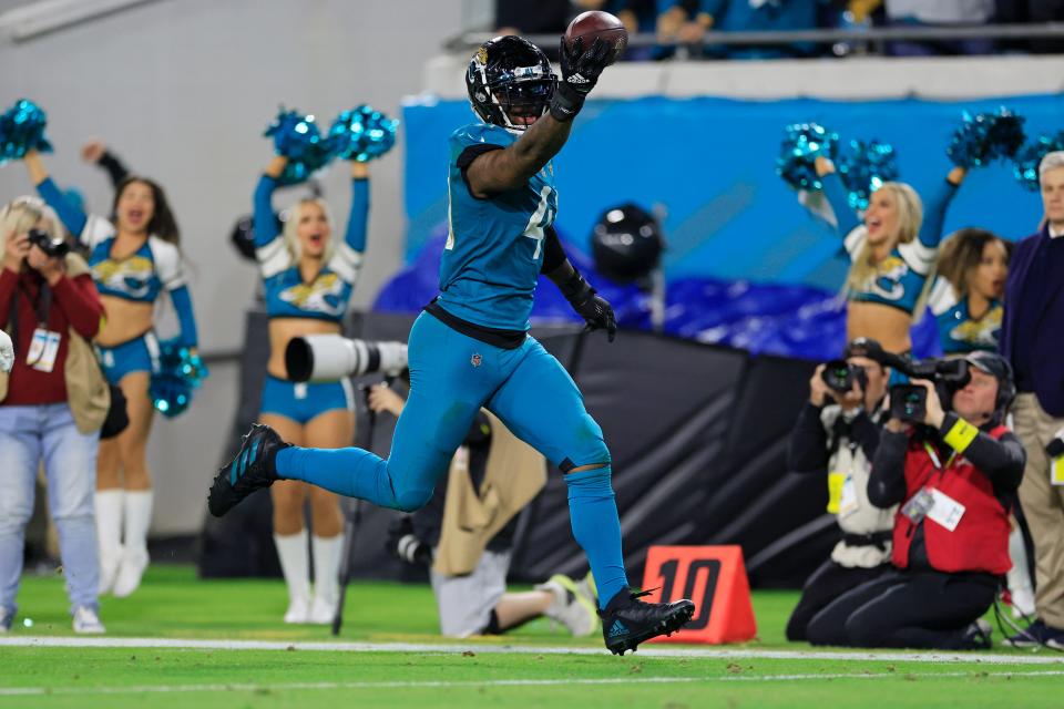 Jacksonville Jaguars linebacker Josh Allen (41) scores a 37-yard touchdown on a fumble return during the fourth quarter of an NFL football regular season matchup AFC South division title game Saturday, Jan. 7, 2023 at TIAA Bank Field in Jacksonville. The Jacksonville Jaguars held off the Tennessee Titans 20-16. [Corey Perrine/Florida Times-Union]