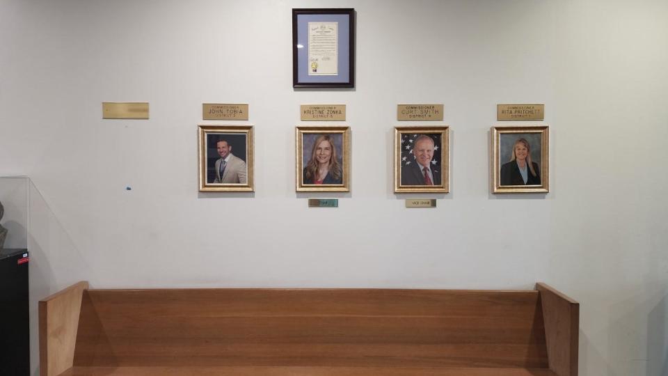 Bryan Lober's photo and nameplate have been removed from this display of photos of Brevard County commissioners in the lobby of the Brevard County Government Center in Viera.