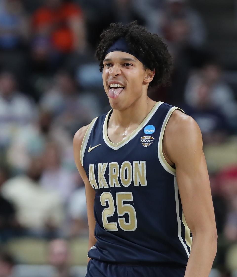 Akron's Enrique Freeman (25) celebrates after a shot during the second half of an NCAA Tournament first-round game against Creighton, Thursday, March 21, 2024 in Pittsburgh.