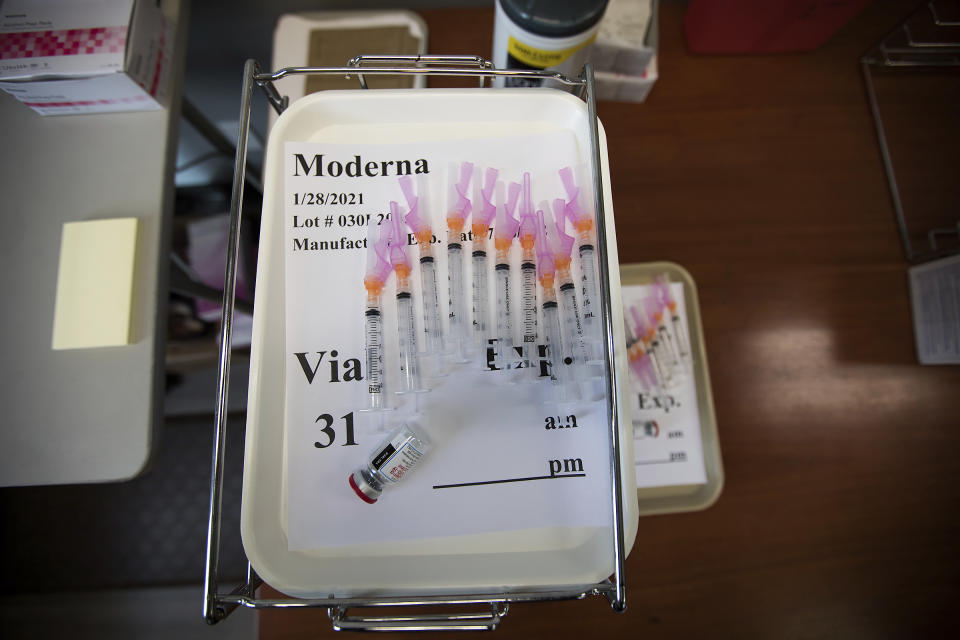 FILE - In this Jan. 28, 2021, file photo, doses of the Moderna COVID-19 vaccine sit in a tray of a pharmacy station at the Hamilton County Health Department's new COVID-19 Vaccination POD at the CARTA Bus Terminal in Chattanooga, Tenn. Despite having some of the lowest COVID-19 vaccination rates in the country, Tennessee isn't planning to offer any incentives for people to get the shot. But it's a different story when it comes to cattle, where the state has reimbursed farmers nearly half a million dollars over the past two years to vaccinate their herds against respiratory and other diseases. (Troy Stolt/Chattanooga Times Free Press via AP, File)