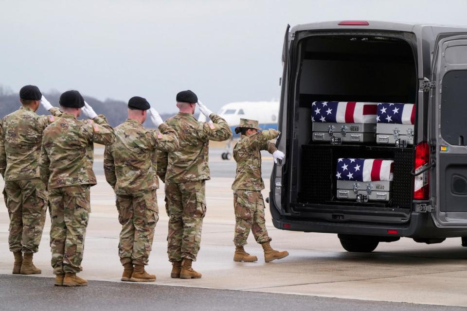 PHOTO: Members of the military salute during the dignified transfer of the remains of Army Reserve Sergeants William Rivers, Kennedy Sanders and Breonna Moffett, at Dover Air Force Base in Dover, Delaware, on Feb. 2, 2024.  (Joshua Roberts/Reuters)