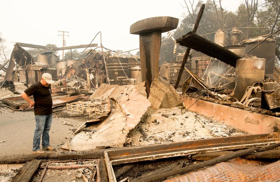 Owner Rene Byck looks over remains of his Paradise Ridge Winery in Santa Rosa, Calif., on Oct. 10. (Photo: Josh Edelson/AFP/Getty Images)