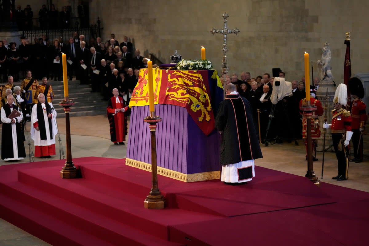 The coffin of Queen Elizabeth II, draped in the Royal Standard with the Imperial State Crown placed on top, lays on the catafalque in Westminster Hall (PA) (PA Wire)