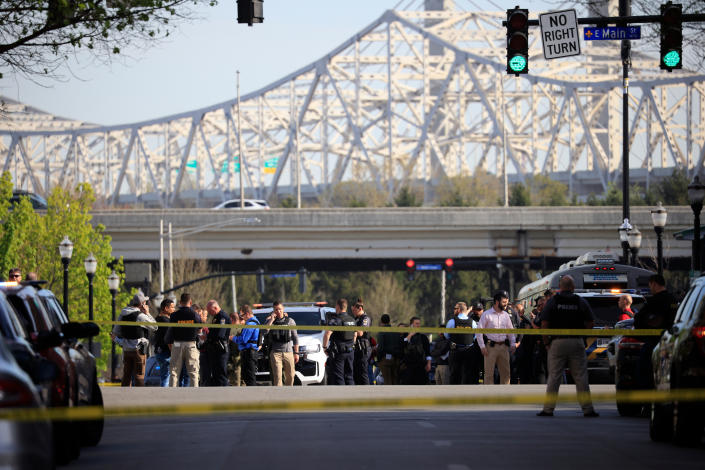 Law enforcement officers respond to an active shooting at the Old National Bank building in Louisville, Ky.