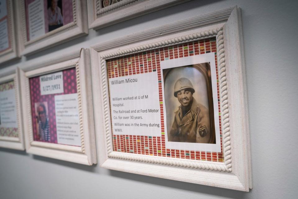 A photograph honoring William Henry Micou, now 99, a military veteran and Red Ball Express driver during World War II, hangs in the hallway at American House Senior Living in Farmington Hills on Monday, August 21, 2023.