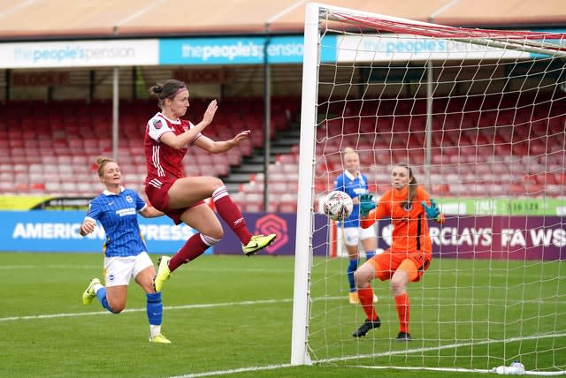 Arsenal’s Lotte Wubben-May scores her side’s fourth goal during their 5-0 win at Brighton