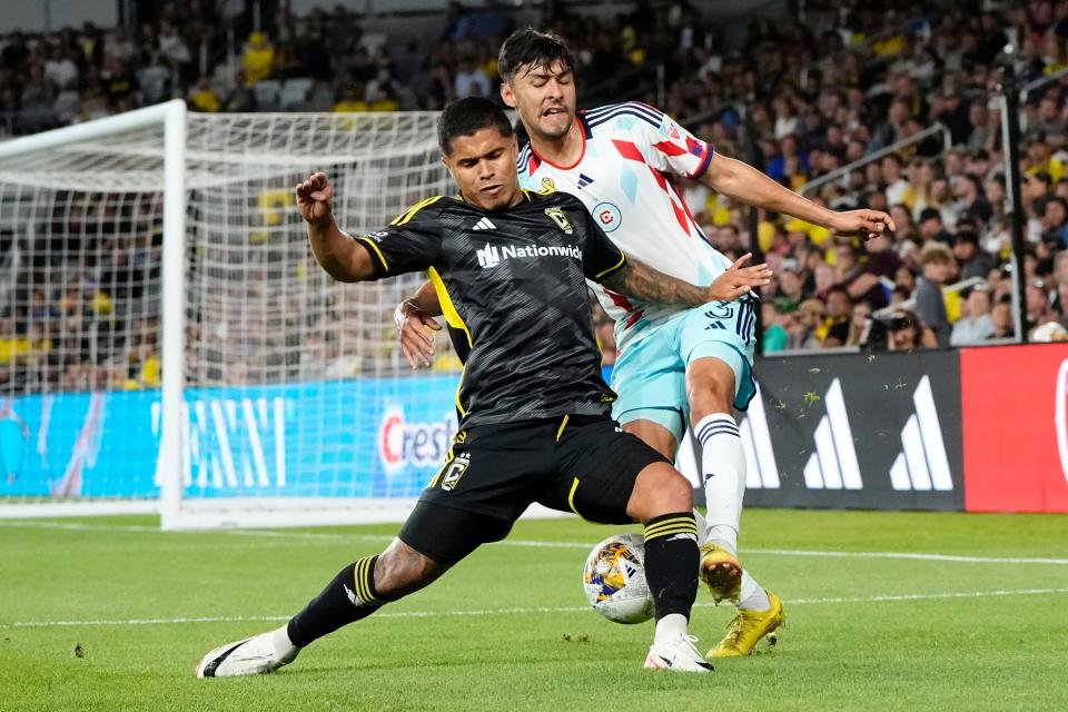 Crew forward Cucho Hernandez fights Chicago Fire defender Alonso Aceves, right, for the ball during Columbus' 3-0 win at Lower.com Field Wednesday.