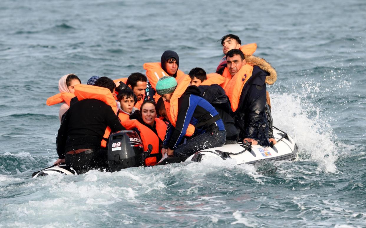 The Telegraph witnessed one migrant boat struggling in choppy waters in the Channel last week - Steve Finn