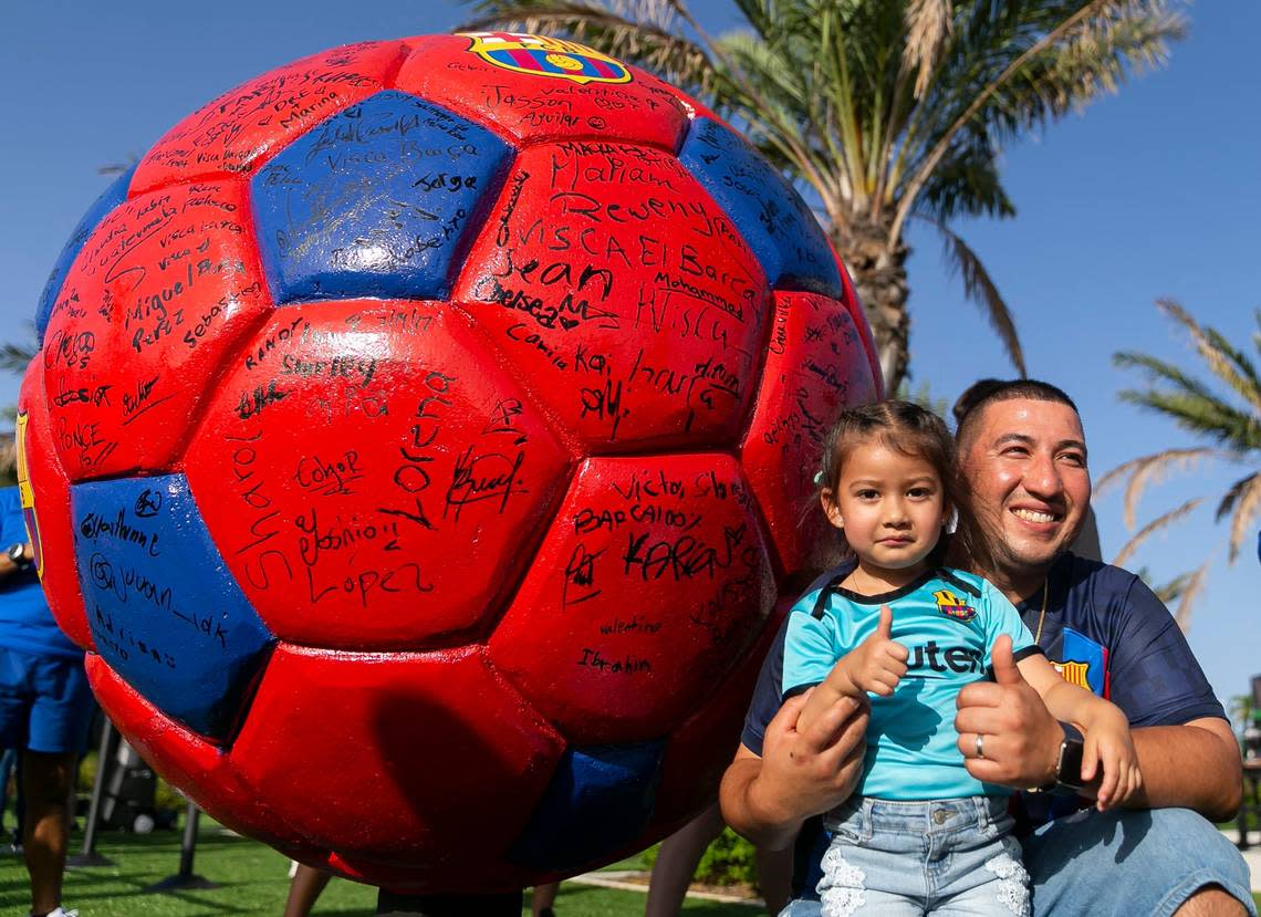 Omar Villeda and his daughter, Eliana Villeda, 3, arrive before the start of a friendly soccer match between Inter Miami CF and FC Barcelona at DRV PNK Stadium on Tuesday, July 19, 2022, in Fort Lauderdale, Fla.