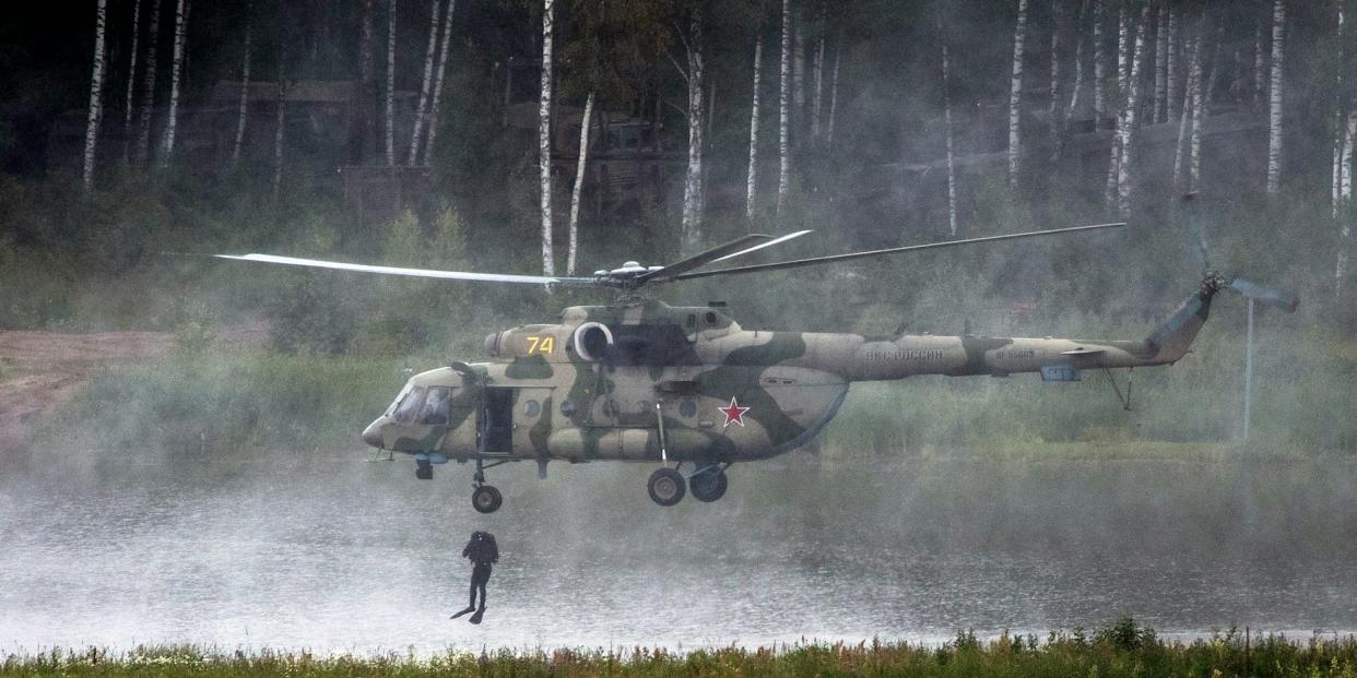 Russian special forces soldier drops into a lake from the Mi-17 helicopter during the International Military Technical Forum Army-2018 in Alabino, outside Moscow, Russia, Saturday, June 29, 2019