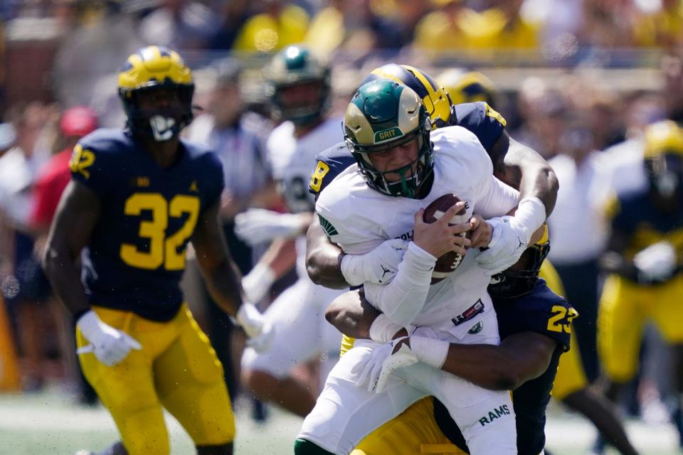 Colorado State quarterback Clay Millen is sacked by Michigan linebacker Michael Barrett (23) during the first half of an NCAA college football game, Saturday, Sept. 3, 2022, in Ann Arbor, Mich. (AP Photo/Carlos Osorio)